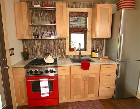 One of the greatest tiny house storage ideas is to build cabinet doors and cubbies to use as a drop zone for shoes and coats, an extra closet for your clothes, or even a kitchen pantry! BlueStar Featured in Tiny House Nation in a home that's ...