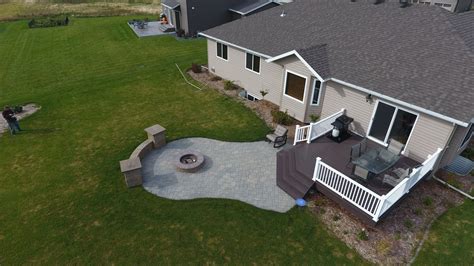 Raised Deck To Patio With Fire Pit And Seat Wall In West Fargo Nd