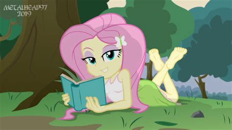 A Pinkie Is Reading A Book In The Grass Near A Tree And Some Trees