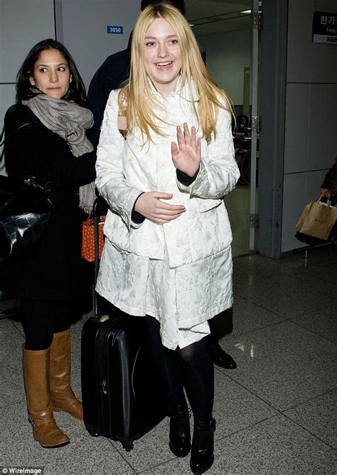 Elle Fanning 14 Towers Over 18 Year Old Dakota At South Korea Fashion Event Daily Mail Online