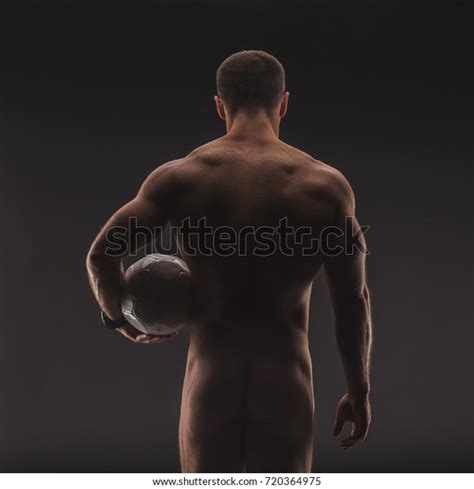 Extremely Muscular Sexy Naked Man With Soccer Ball Closeup Strong Nude Male Body Shot From The Back