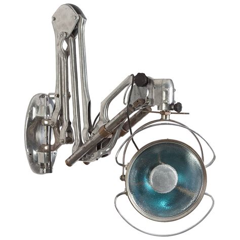 1930 industrial enamel sconce lighting. Industrial Articulated Aluminum and Chrome Swing-Arm ...