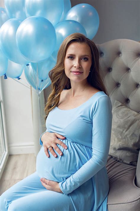 Pregnant Young Girl In Blue Dress Sitting On Chair Photograph By Elena