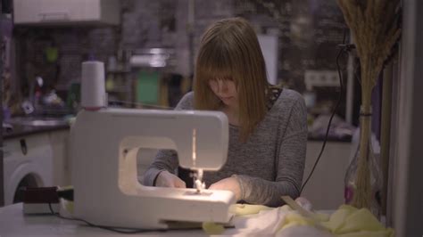 Female Fashion Designer Seamstress Dressmaker Working On A Sewing