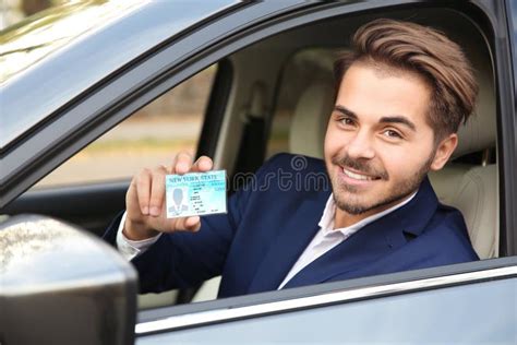 Young Man Holding Driving License Stock Photo Image Of License