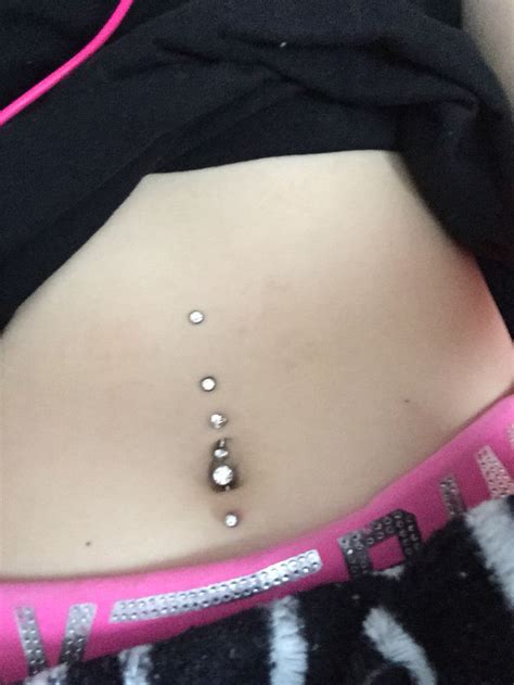 Top And Bottom Belly Button Piercings With Two Dermals On Top Belly Button Piercing Belly