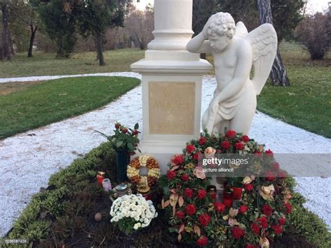 Candles And Flowers On The Grave Of Composer Wolfgang Amadeus Mozart