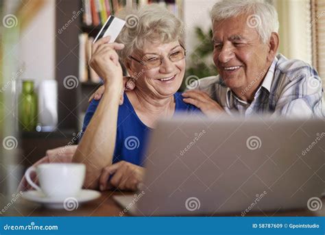 Senior Couple Using Laptop Stock Image Image Of Credit 58787609