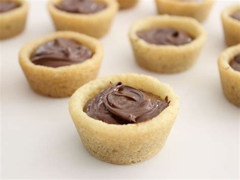 Its time to make sugar cookies. Nutella Cookie Cups : What You'll Need: 1 roll store ...