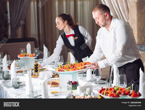 Waiters Serving Table Image & Photo (Free Trial) | Bigstock
