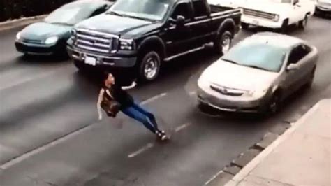 Car Hits Woman In High Heels After She Slips While Running