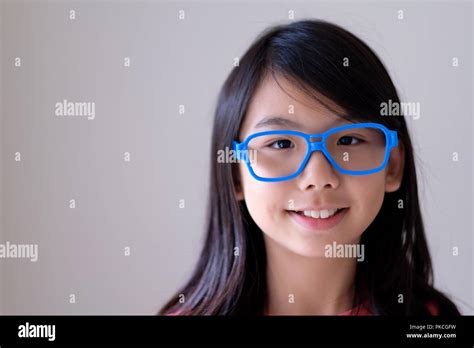 Portrait Of Asian Teenager With Big Blue Glasses Stock Photo Alamy