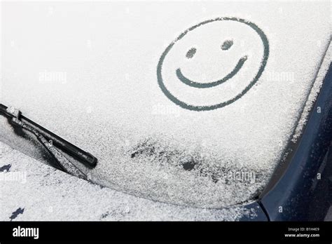 Smiley Face In Snow On Car Stock Photo Alamy