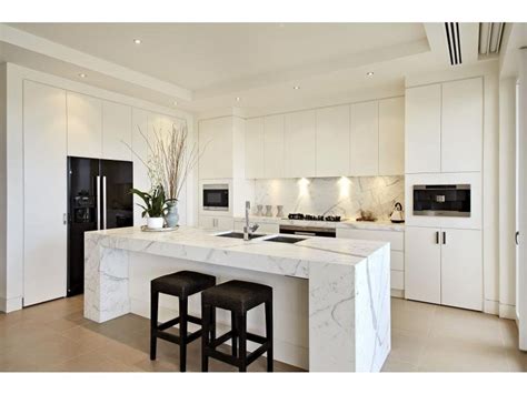 Embracing minimalism in your kitchen design can help establish a feeling of order and create the illusion of space. Decorative lighting in a kitchen design from an Australian home - Kitchen Photo 1457209