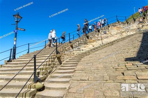 Tourists Climb Steep 199 Steps Up Towards Whitby Abbey Whitby