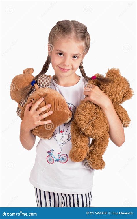 Little Girl Holding A Teddy Bear Isolated On White Background Stock