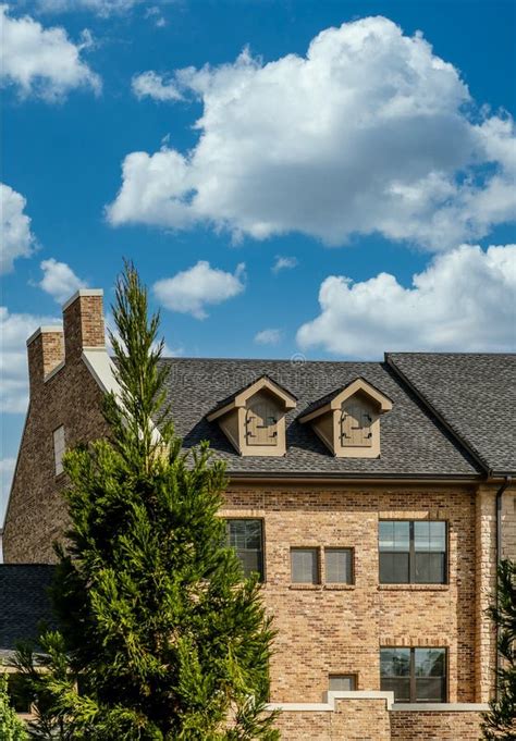 Two Dormers On Brick Homes With Wood Shingles Stock Photo Image Of