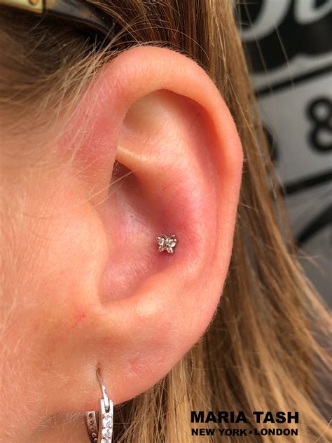 Fresh Conch Piercing With A Jewelry From The Brand Maria Tash The
