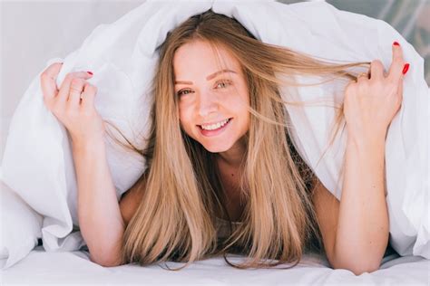 Free Photo Blonde Girl Posing On The Bed