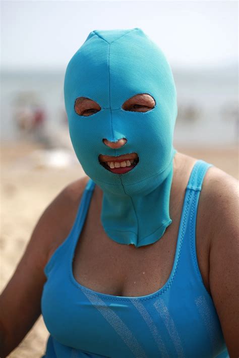Chinese Women Don Face Ski Masks On The Beach As A Sun Protection