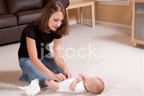 Mother Changing Baby Diaper Stock Photo Royalty Free Freeimages