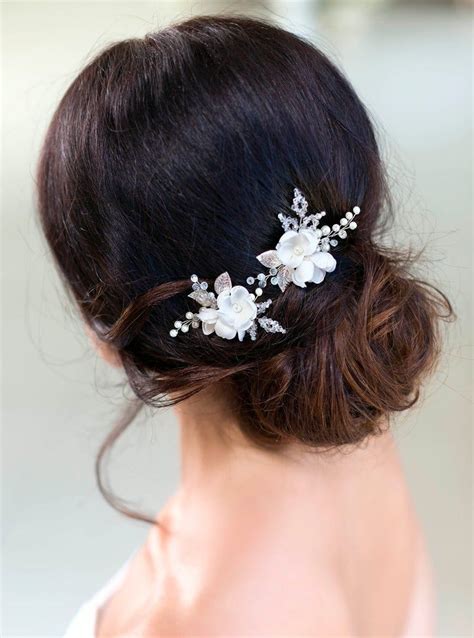 A Woman Wearing A Hair Comb With Flowers On It