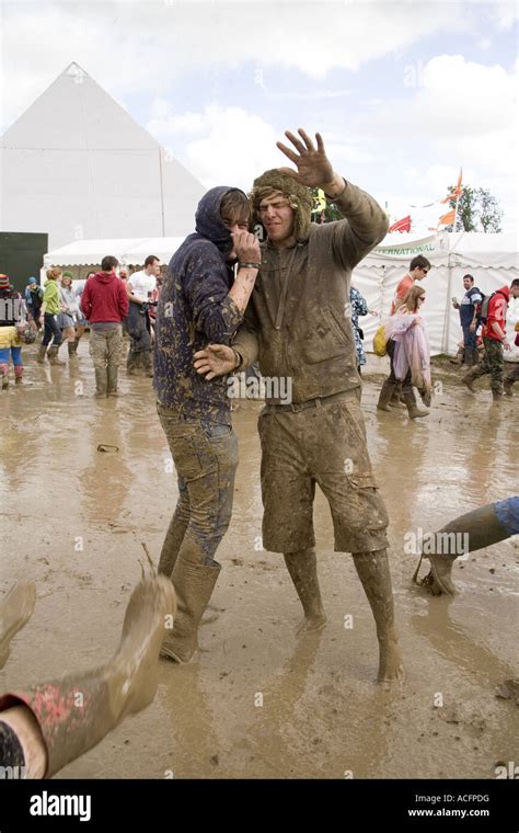 Two happy guys covered in mud at the Glastonbury festival 2007 Stock ...