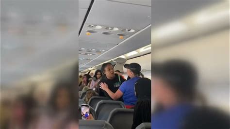 video frontier airlines passenger gets in fight tries to bite cops after getting carried off