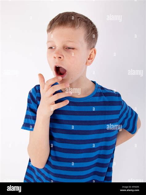 Cute Young Tired Boy Yawning Stock Photo Alamy