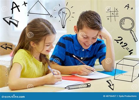 Group Of School Kids Writing Test In Classroom Stock Image Image Of