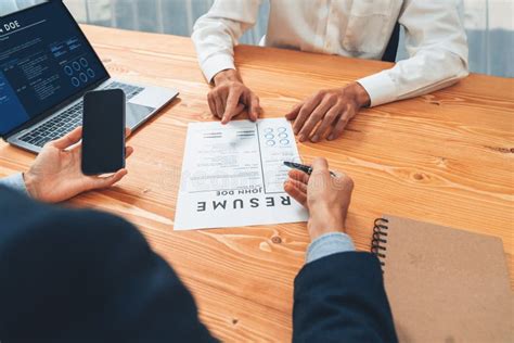 Job Candidate Engaging Conversation With Interviewer During Job