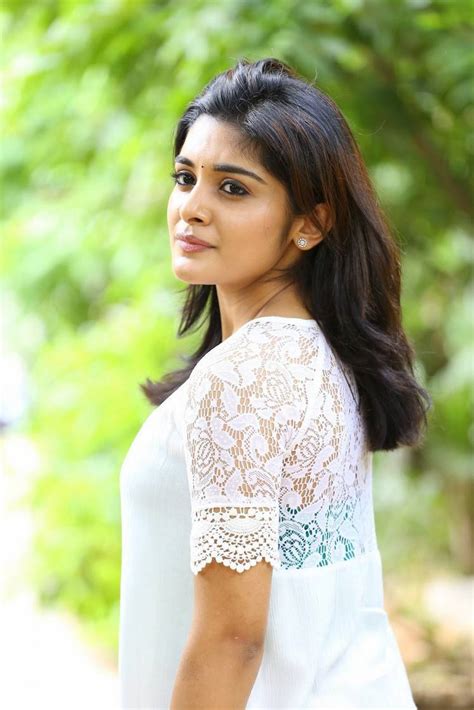 niveda thomas latest hot spicy glamour photoshoot images in white top images
