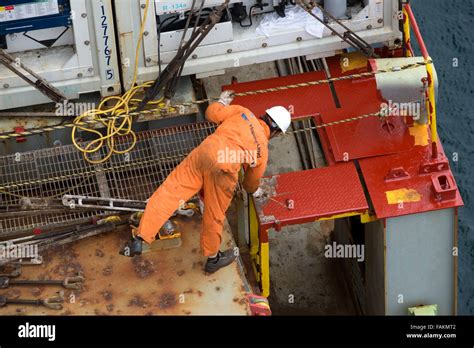 Container Ship Crew Member Works On The Deck Of Utrillo Cargo Vessel