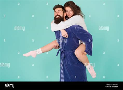 Lets Stay At Home And Have Fun Couple In Bathrobes Having Fun Turquoise Background They Always