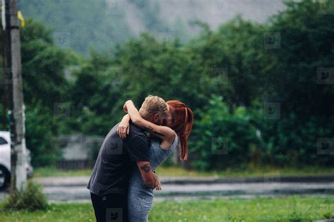 Couple Hugging In The Rain