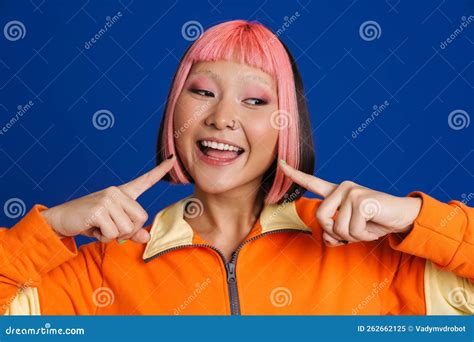 Asian Girl With Pink Hair And Piercing Pointing Fingers At Her Smile Stock Image Image Of