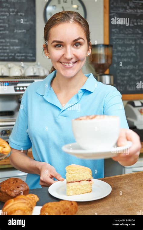 Waitress In Cafe Serving Customer With Coffee Stock Photo Alamy