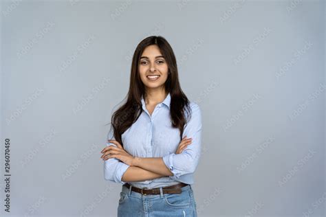 Smiling Indian Young Woman Sales Professional Arms Crossed Looking At