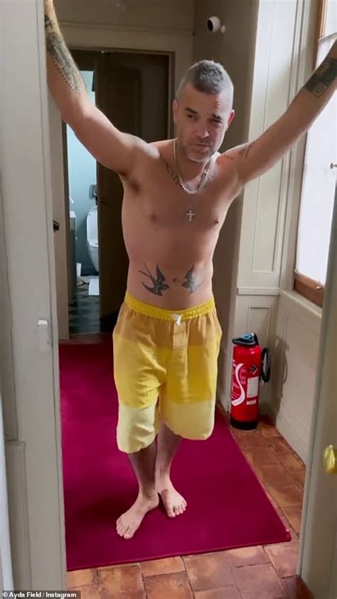Not Afraid To Be Sexy Robbie Williams Poses Shirtless And Delivers A Series