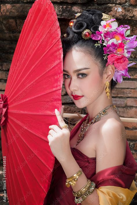 Beautiful Thai Girl In Traditional Dress Costume Red Umbrella As Thai Temple Where Is The Public