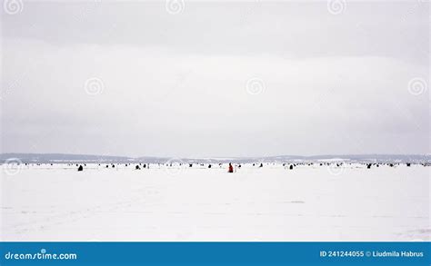 Fishermen Catch Fish On A Frozen Lake On Winter Fishing Stock Image