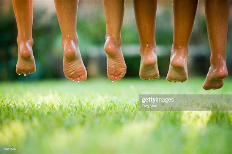 Row Of Hispanic Girls Wet Bare Feet Photo Getty Images