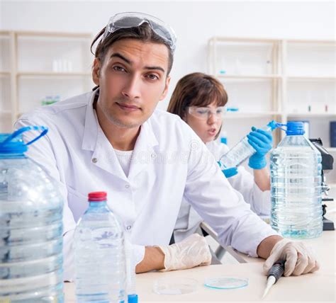 Two Chemists Working In The Lab Stock Photo Image Of Examining