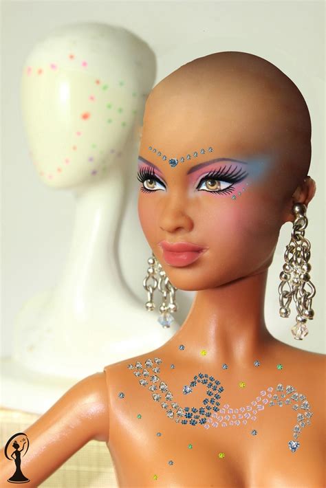 A Close Up Of A Mannequin With Glitter On It S Body And Head