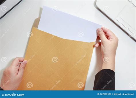 Businesswoman Hands Holding The Blank Paper In Envelope Business