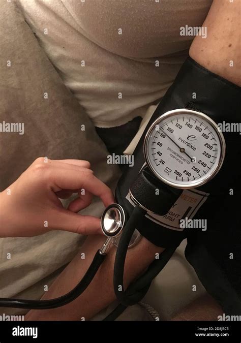 Nurse Taking Patients Blood Pressure Stock Photo Alamy