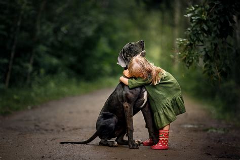 Little Girl Hugging Her Dog
