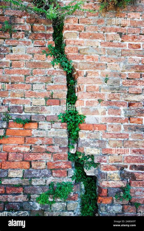 Deep Crack In An Old Damaged Brick Wall Stock Photo Alamy