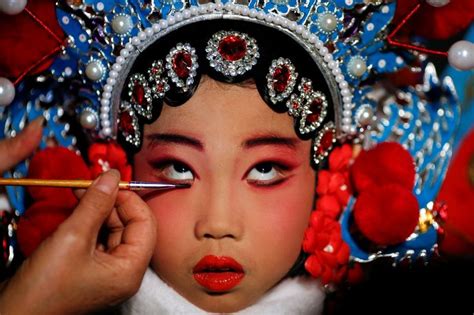 A Participant In A Traditional Chinese Opera Competition Having Her