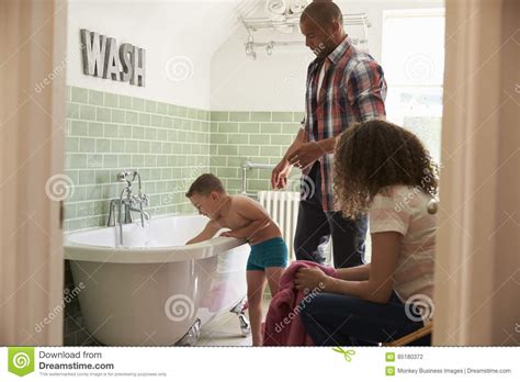 Parents And Son Having Fun At Bath Time Together Stock Photo Image Of